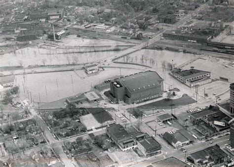 an aerial view of a large building in the middle of a city with flood ...