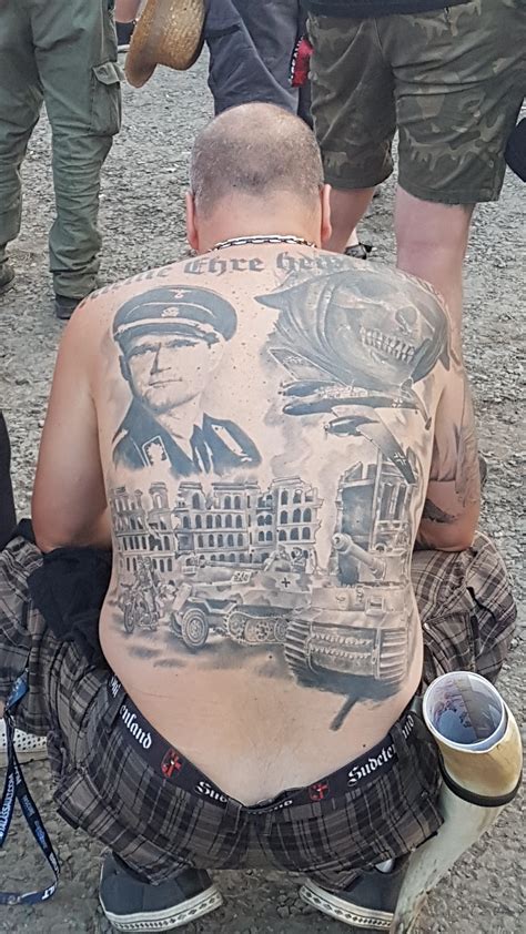 This "person" with all back Nazi tattoo at an Open air festival : r/trashy