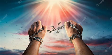 Premium Photo | Hands in fists breaking a chain freedom The concept of ...