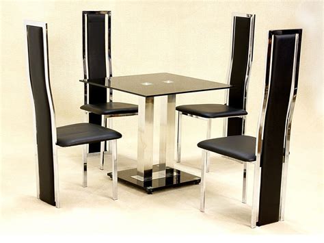 Small square glass dining table and 4 faux chairs in black