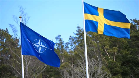 Sweden’s flag is raised at NATO headquarters to cement its place as the 32nd member of the ...