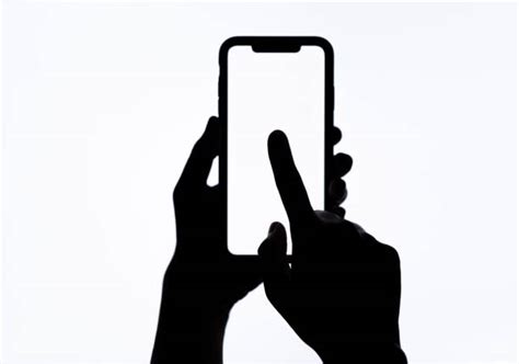 Hand Holding Phone Silhouette Stock Photos, Pictures & Royalty-Free Images - iStock