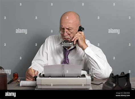 Vintage Journalist at work. Desk with telephone and typewriter. Writer editor Stock Photo - Alamy