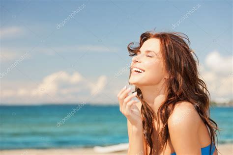 Laughing woman on the beach — Stock Photo © Syda_Productions #11943452