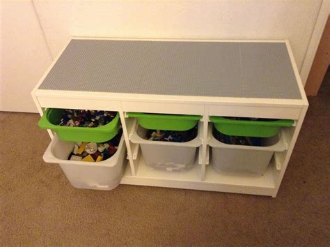 My husband made our boys a LEGO table from an IKEA cabinet w/ storage drawers, 3 gray LEGO ...