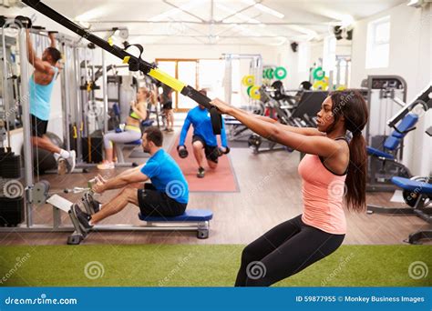 People Working Out on Fitness Equipment at a Busy Gym Stock Image ...