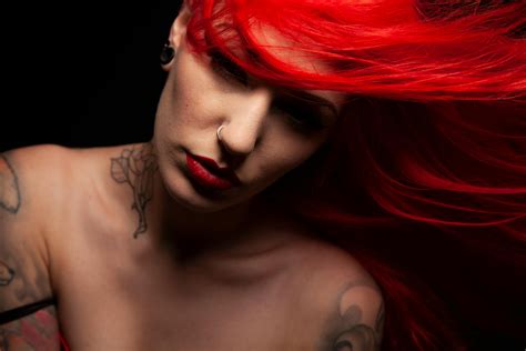 Beautiful Woman with a Nose Ring and Tattoos · Free Stock Photo