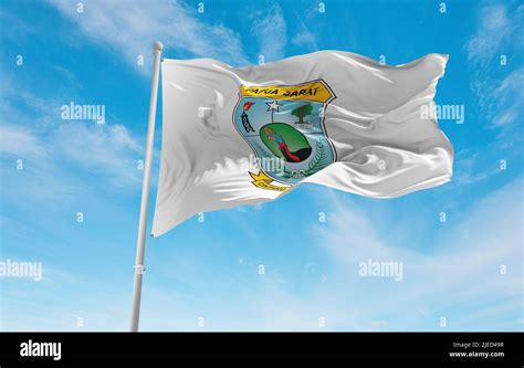 official flag of West Papua Indonesia at cloudy sky background on ...