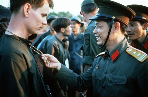 K.Diallo ☭ on Twitter: "A North Vietnamese Army officer laughs at the peace symbol necklace of a ...