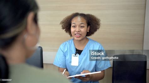 Hospital Reception Desk Stock Photo - Download Image Now - Nurse, Patient, Talking - iStock