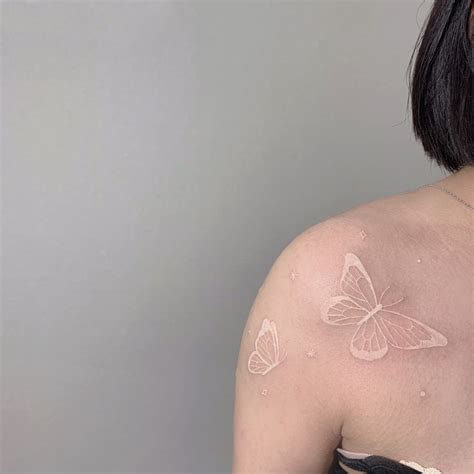 White ink butterfly tattoo | White butterfly tattoo, Pink tattoo ...