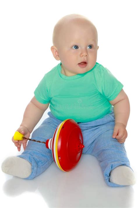 A Little Boy is Playing with a Toy Car. Stock Photo - Image of hands, blond: 111808858