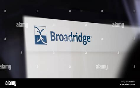 March 2023. The Broadridge logo on a wall of screens Stock Photo - Alamy