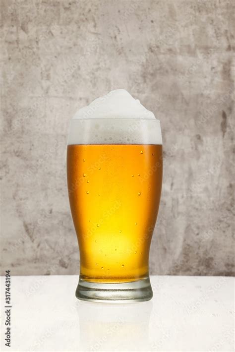 Beer splash in glass on vintage background with copy space Stock Photo ...