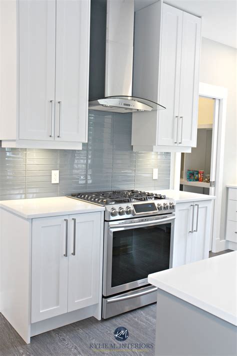 White shaker style cabinets, white quartz countertops, Coventry Gray ...