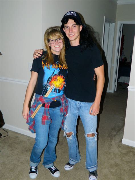 a man and woman standing next to each other in a room with carpeted floors