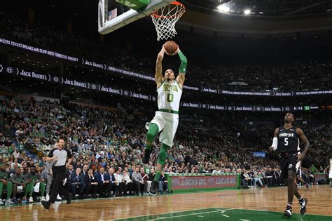 BOSTON, MA - MARCH 1: Jayson Tatum #0 of the Boston Celtics dunks the ...