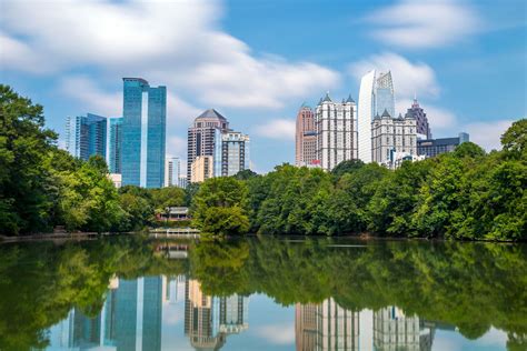 Skyline and reflections of midtown Atlanta, Georgia - Merritt Watson, LLP