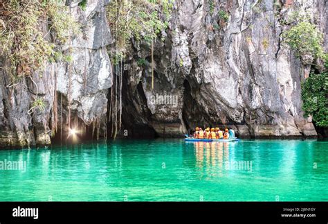 Cave entrance of Puerto Princesa subterranean underground river with longtail boat - Wanderlust ...