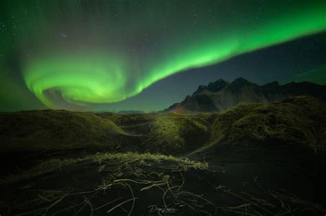 Northern Lights over Vestrahorn Mountain from Stokksnes, Iceland