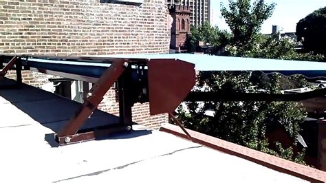 Roof Mounted Retractable Awning Installation in Manhattan - YouTube