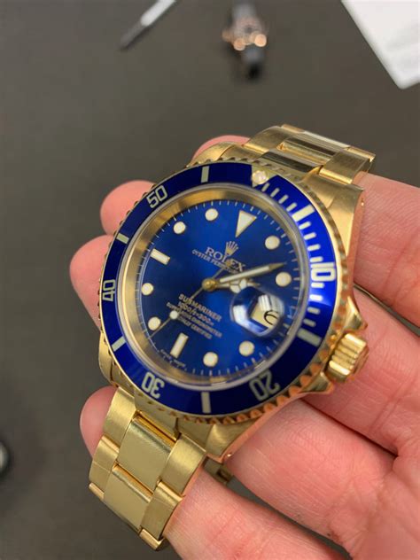 Rolex 16618 Submariner 18k Yellow Gold & Blue Watch Review – Raymond Lee Jewelers