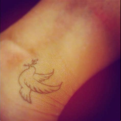 Little dove peace tattoo | White tattoo, Tattoos, Peace tattoos