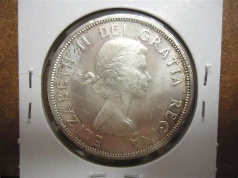 1858-1958 CANADA SILVER DOLLAR