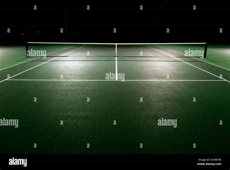 Tennis court by night Stock Photo - Alamy