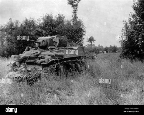 U.S. light tank equipped with the 'Culin Hedgecutter' for breaching the Norman hedgerows. The ...
