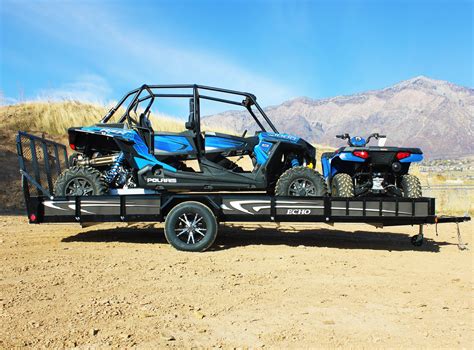 RZR & ATV Loaded on 17' Ultimate UTV/ATV Trailer with white graphics and aluminum mag rims ...