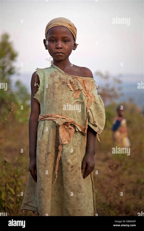 portrait of a young girl in worn-out dress, Burundi, Karuzi, Buhiga ...