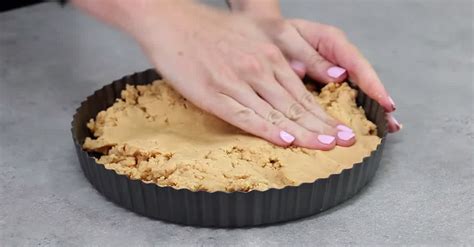 She Squishes Peanut Butter Filling Into This Baking Pan. Why? DELICIOUS!! | LittleThings.com