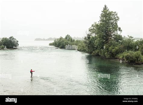 Fisherman doing fly-fishing in Loisach river at Kochelsee, Bavaria, Germany Stock Photo - Alamy