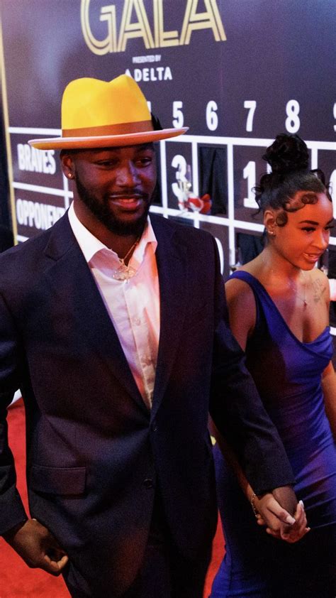 Michael Harris II and girlfriend Esther Starr walk down the red carpet ...