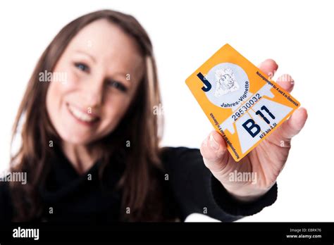 young woman presenting an Austrian annual motorway vignette 2011 ...