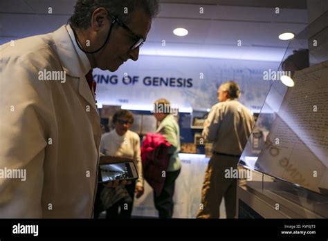 Davenport, Iowa, USA. 7th Dec, 2017. Chief Medical Officer Nidal Harb looks at an old patient ...