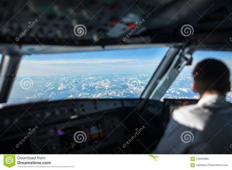 Pilot in a Commercial Airliner Airplane Flight Cockpit Stock Photo - Image of airborne ...