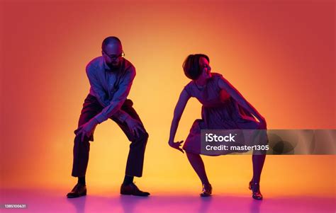Portrait Of Excited Man And Woman Couple Of Dancers In Vintage Retro Style Outfits Dancing Lindy ...
