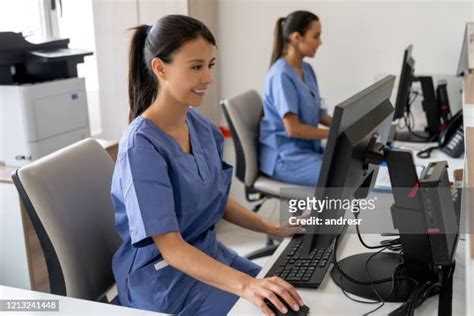 Medical Receptionist Uniforms Photos and Premium High Res Pictures ...