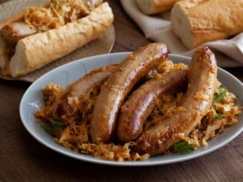 Bratwurst Stewed with Sauerkraut Recipe | Michael Symon | Food Network