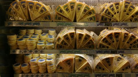 Cheddar cheese being sold in the Cheddar shop at Cheddar Gorge ...