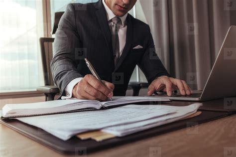 Businessman working at his office desk stock photo (136638) - YouWorkForThem