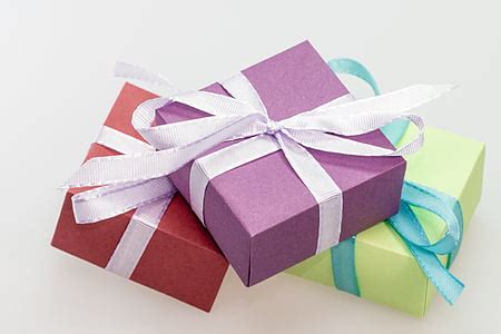 Royalty-Free photo: Three assorted-color gift boxes | PickPik
