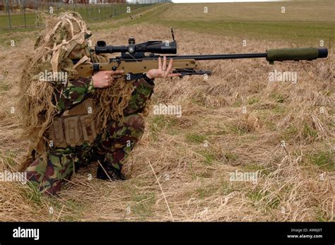 British Infantryman with a long range sniper rifle L115A3 which has a killing capability from ...