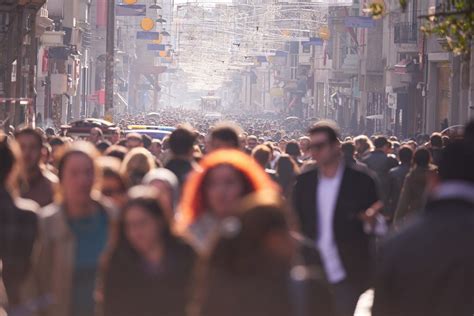 Crowds of people walking on a busy city street. | Autodesk News