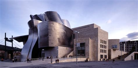 Guggenheim Museum, Bilbao: the entrance facade clad in titanium and ...