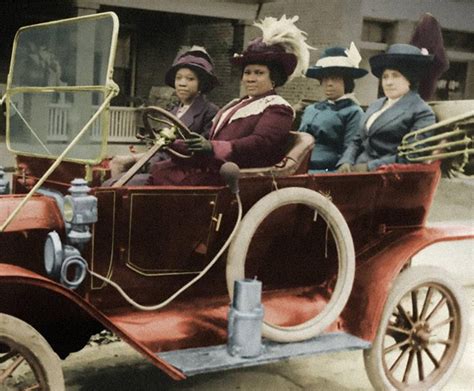 A colorized photo of Madam C. J. Walker with her friends and her Ford, the first of her family ...