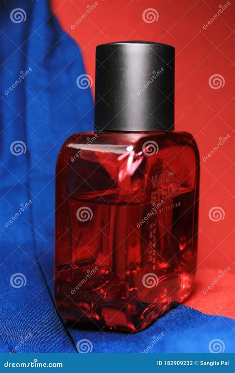 Red Color Men Perfume Bottle Isolated on Red Background with Female ...