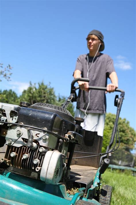 Teenage boy mowing lawn stock image. Image of adolescence - 13917593